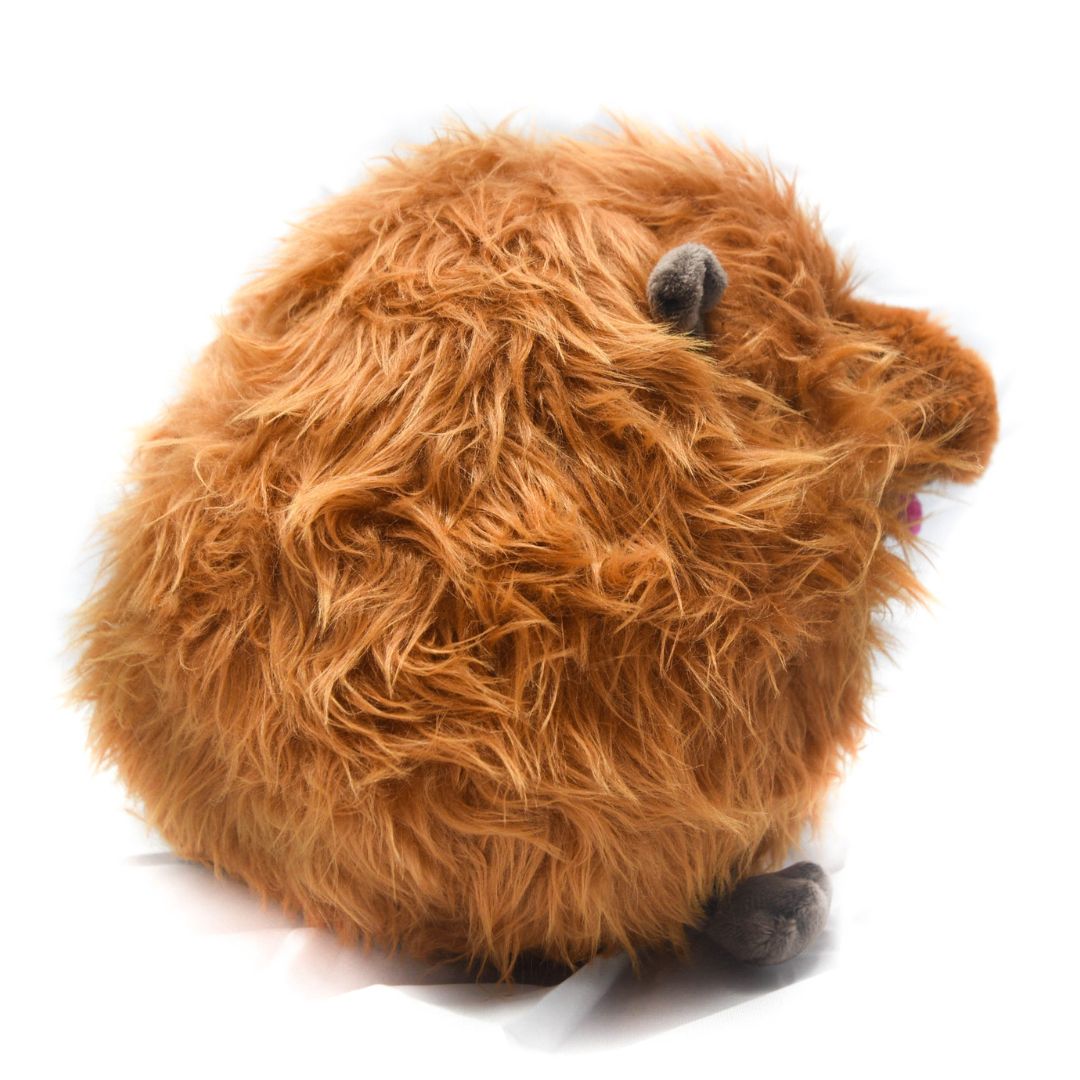 Plush toy resembling a brown woolly haggis animal animal on a white background